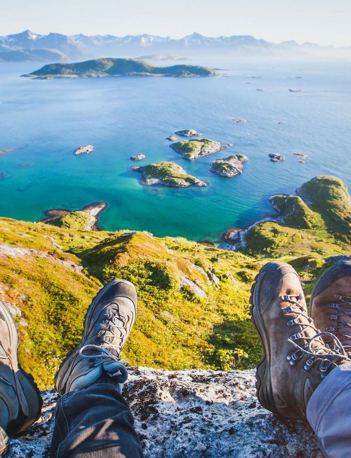 northern norway hikers resting at viewpoint senja istk